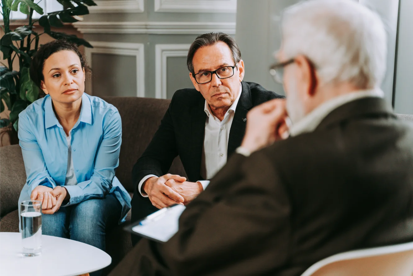 Attorney meeting with clients in conference