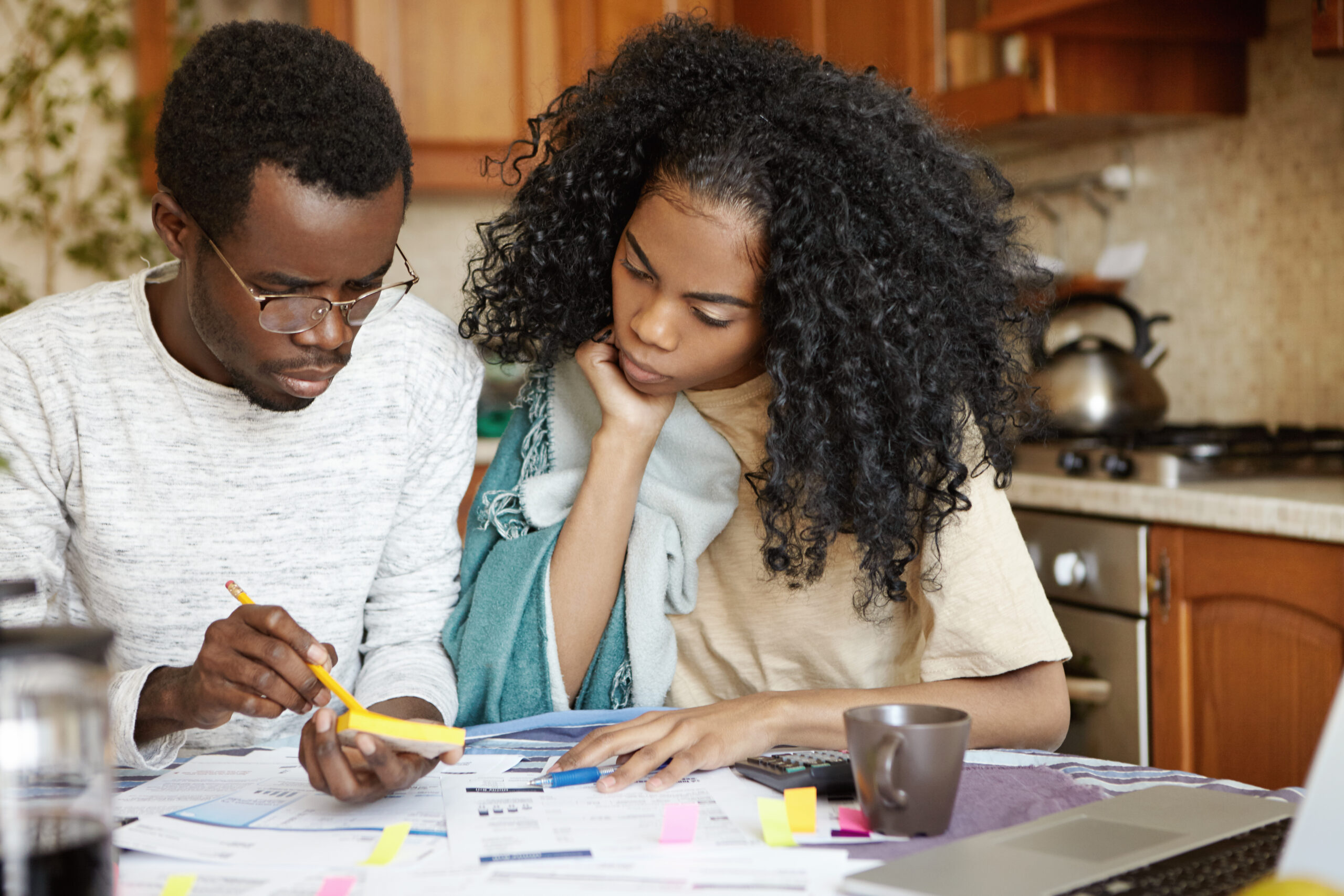 Couple reviewing bills and paperwork together