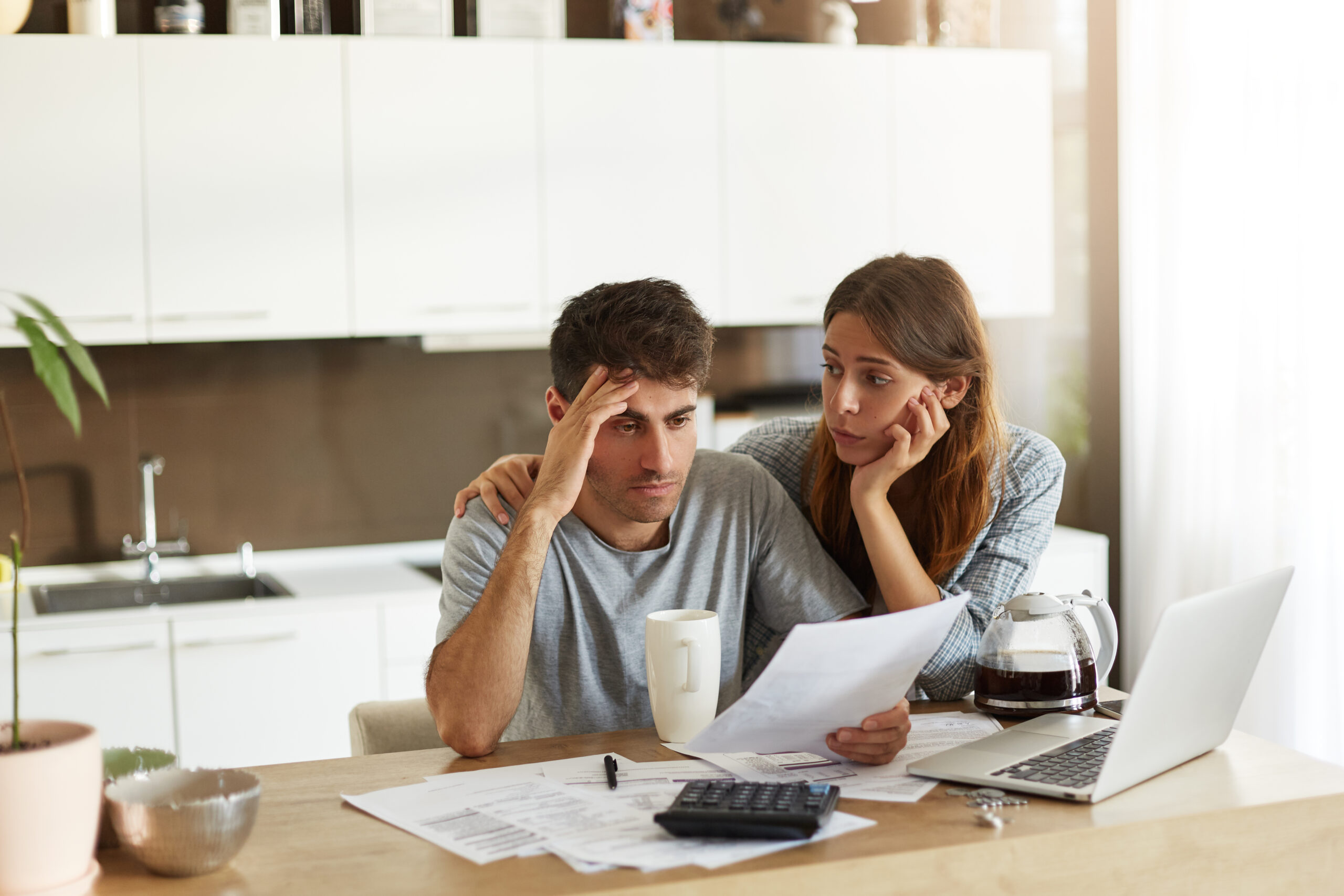 Couple reviewing bills and paperwork together